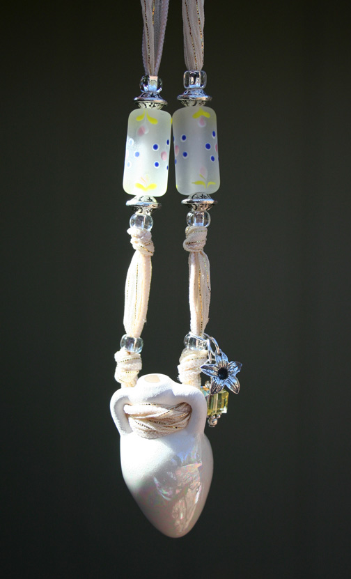 aromatherapy necklace hanging in the sun