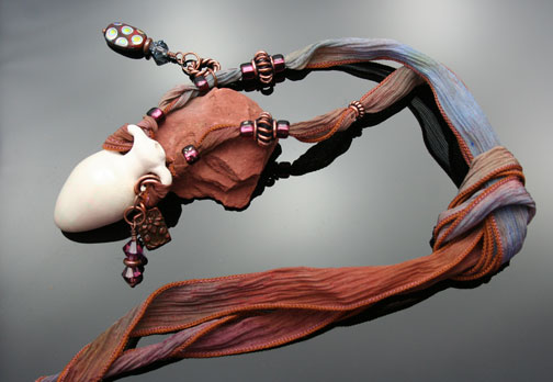 soft watercolor silk ribbon with beatiful beads and copper charms adorn this mini-amphora aromatherapy necklace